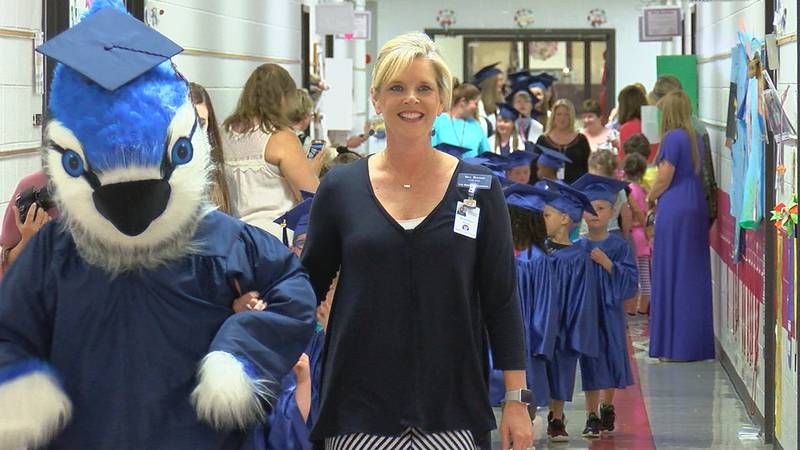 Oak Mountain students walk the hallways in cap and gown